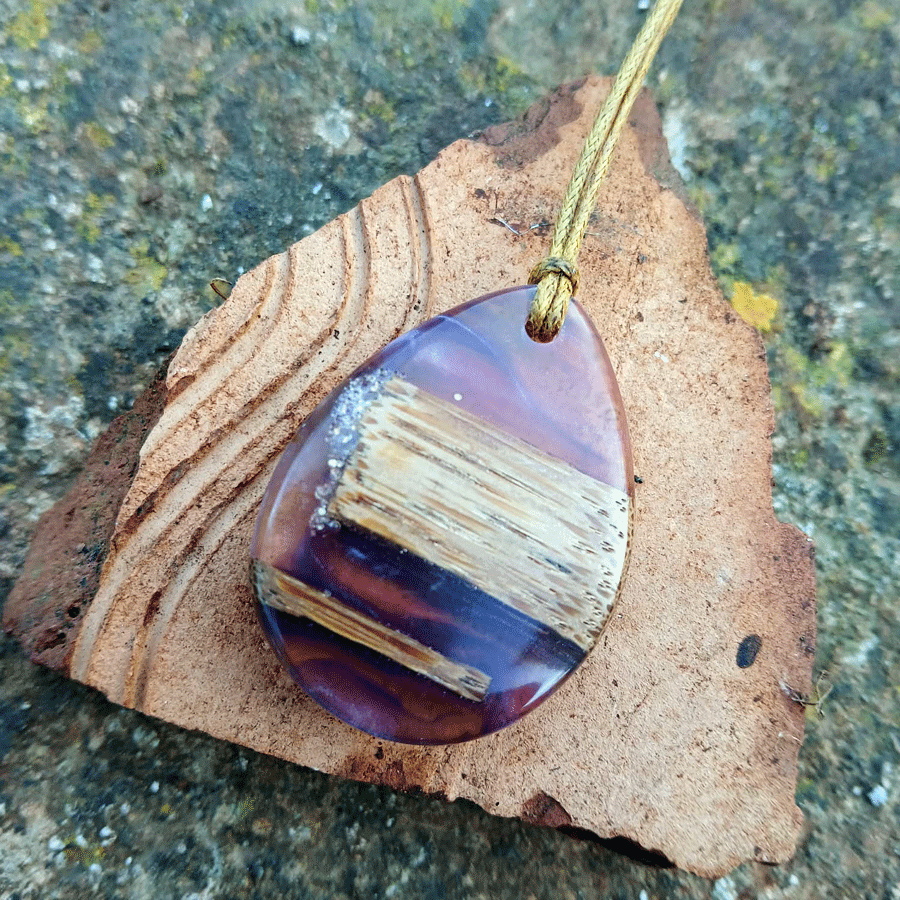 Driftwood with transparent purple and pink resin
