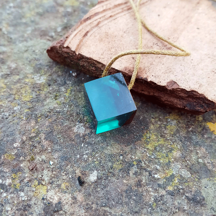 Driftwood with transparent teal resin