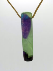 Driftwood with metallic green and purple resin