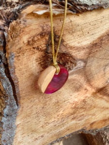 Driftwood with pink resin and purple heart