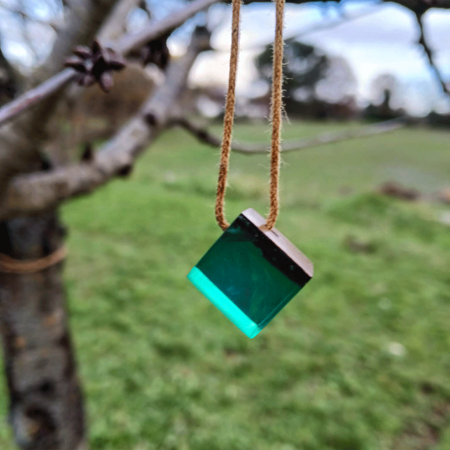 Driftwood with transparent teal resin