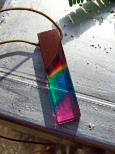 Driftwood with rainbow coloured resin