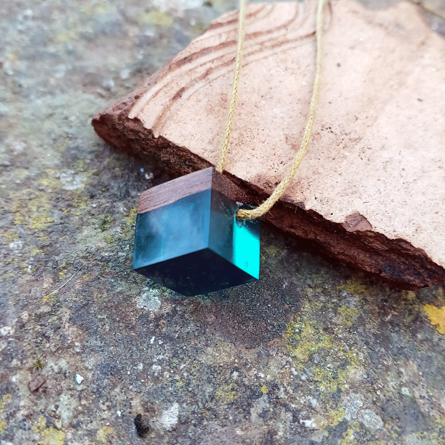 Driftwood with transparent teal resin