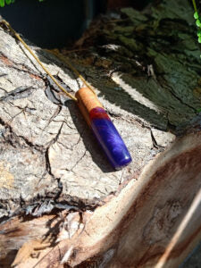 Driftwood with metallic purple resin