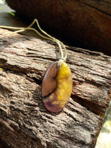 Driftwood with metallic yellow and purple resin