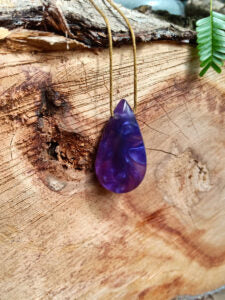 Driftwood with metallic purple resin