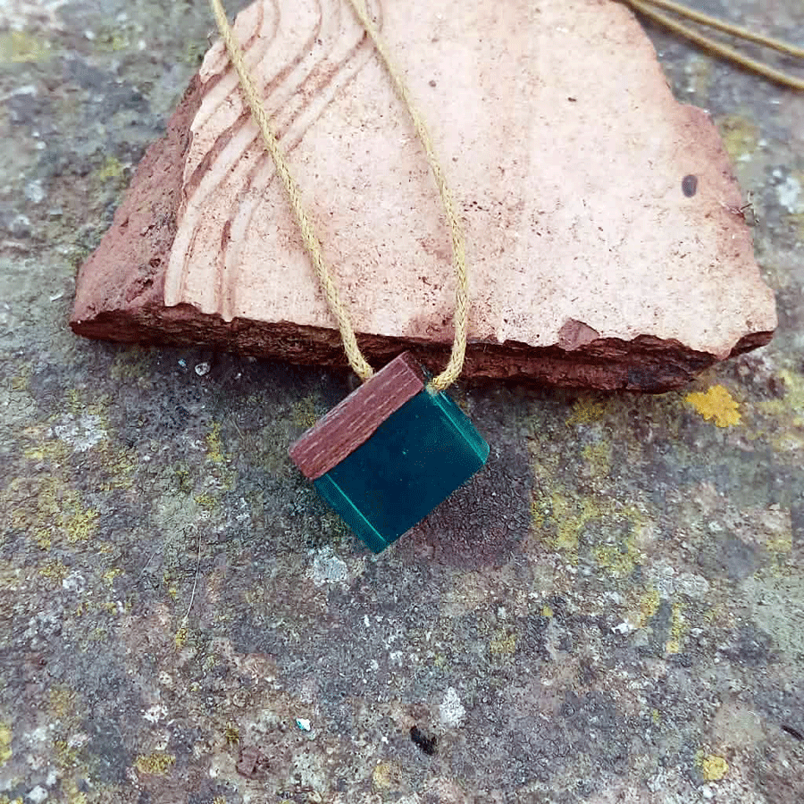 Driftwood with transparent teal resin