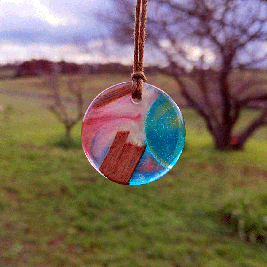 Driftwood with transparent turquoise and pink resin