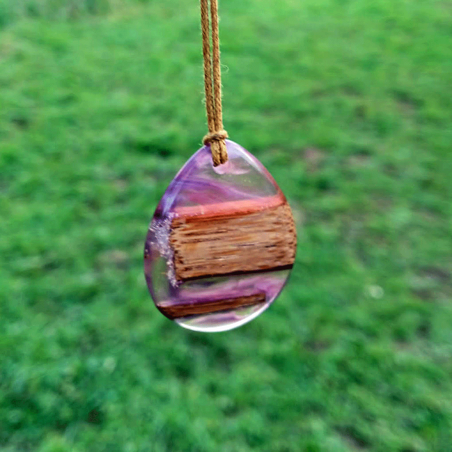 Driftwood with transparent purple and pink resin