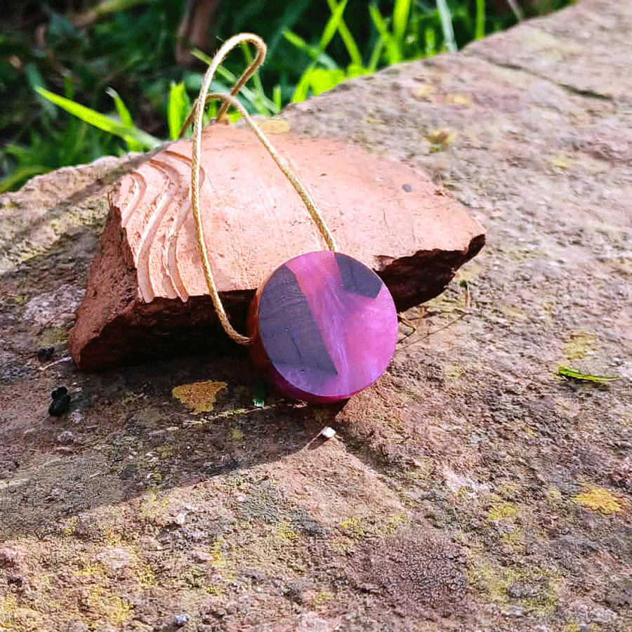 Driftwood with metallic pink resin
