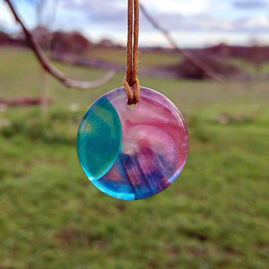 Driftwood with transparent turquoise and pink resin