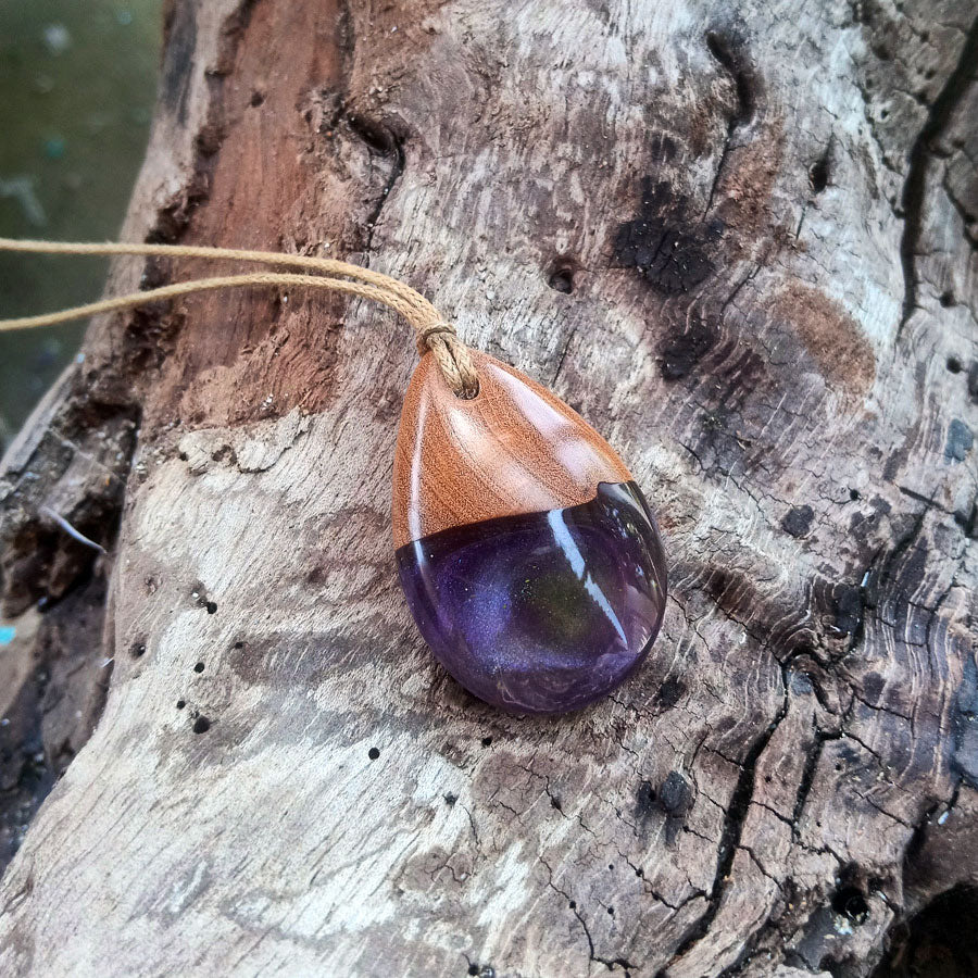 Driftwood with light purple and green resin