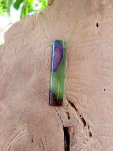 Driftwood with metallic green and purple resin