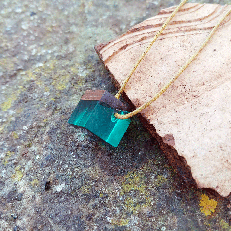 Driftwood with transparent teal resin