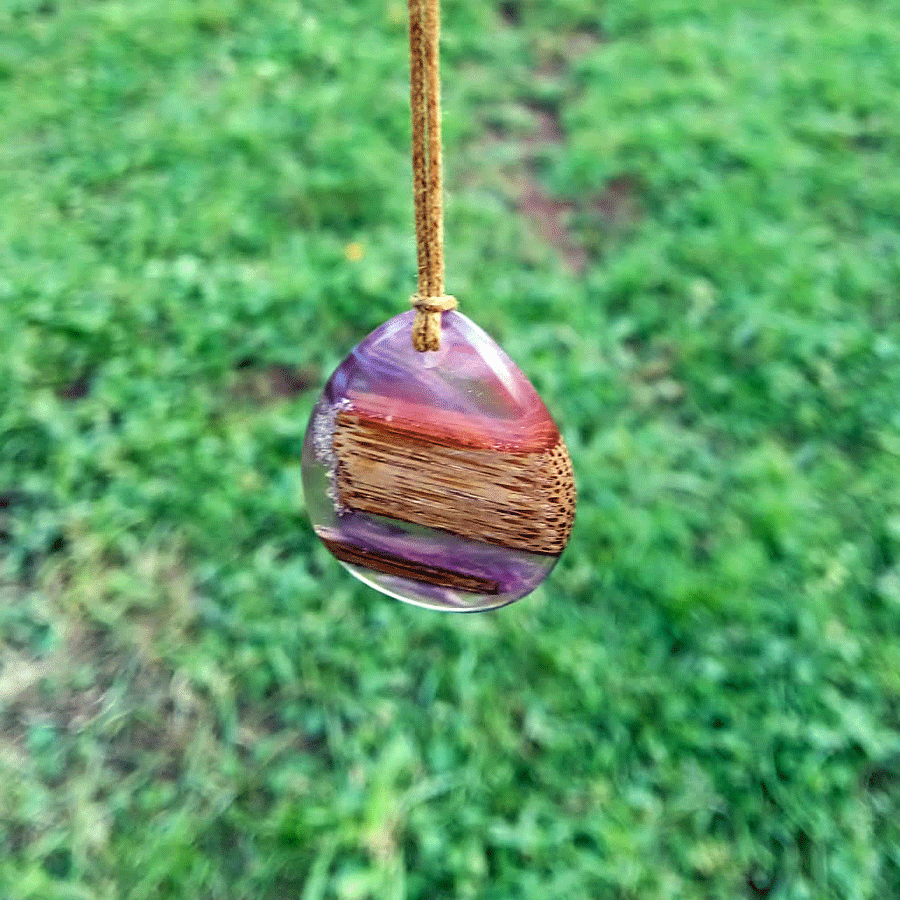 Driftwood with transparent purple and pink resin