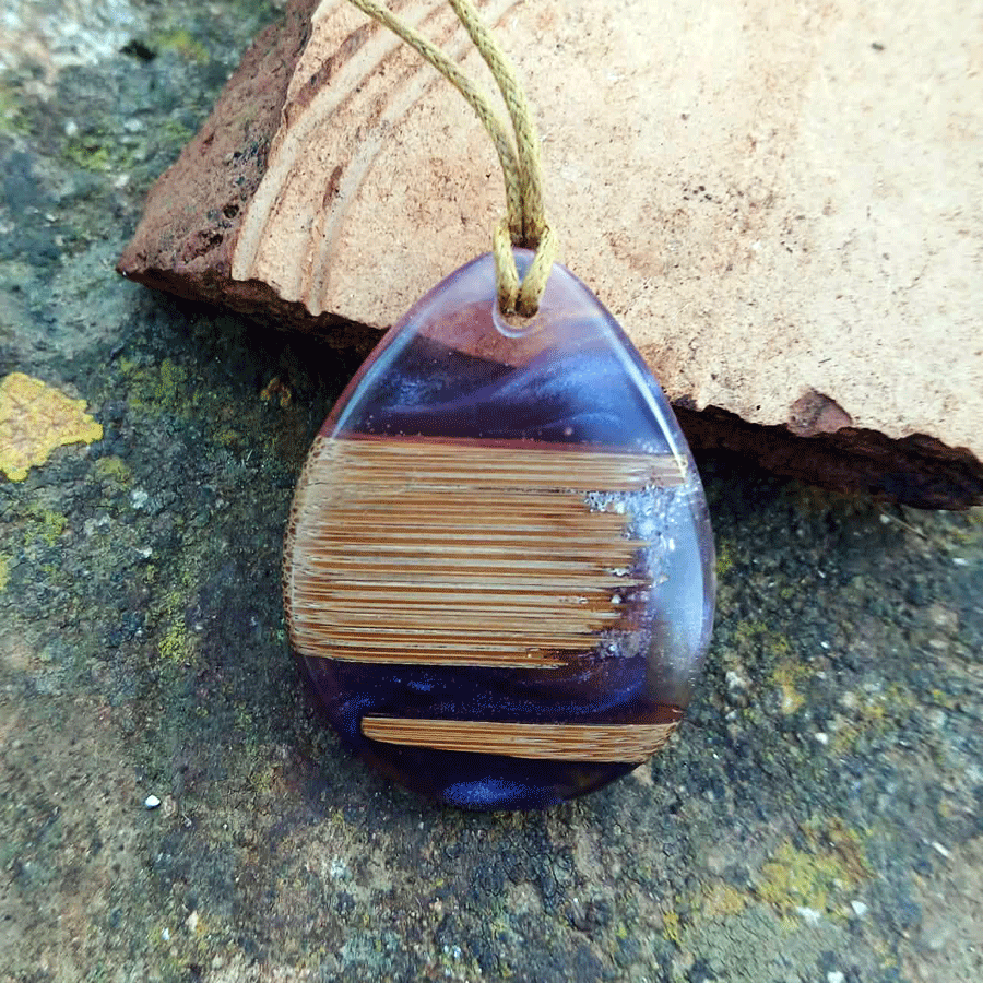 Driftwood with transparent purple and pink resin