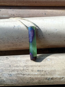 Driftwood with metallic green and purple resin