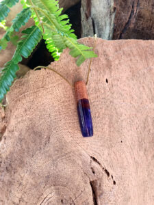 Driftwood with metallic purple resin