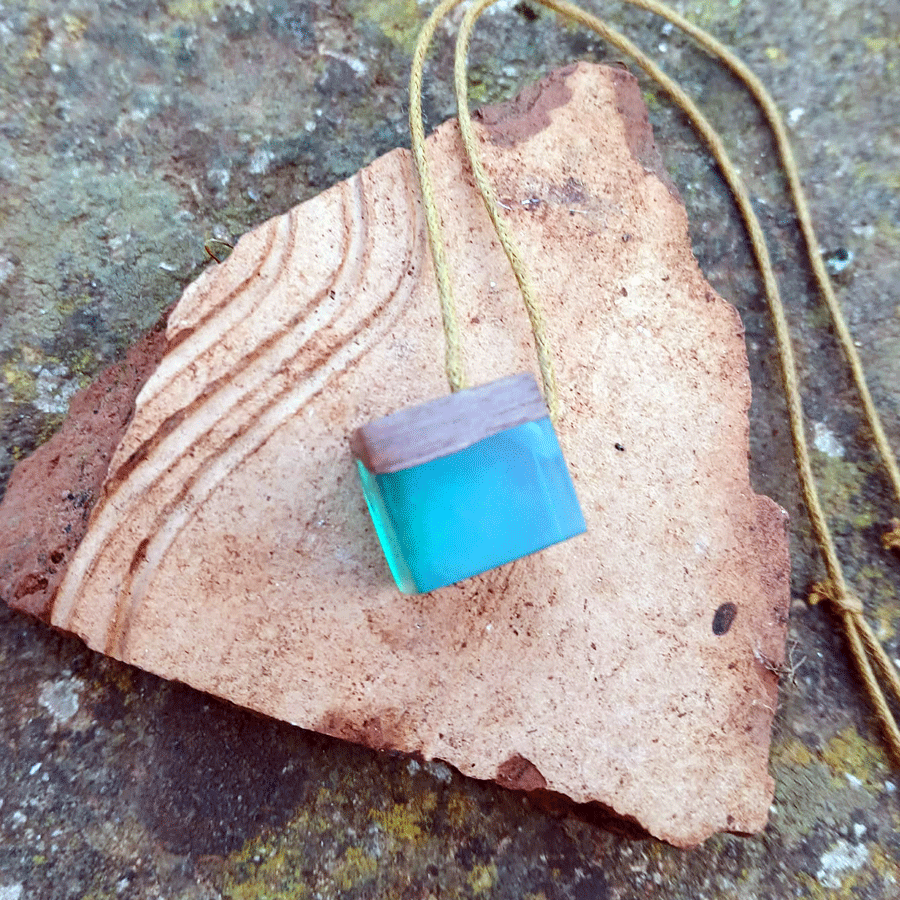 Driftwood with transparent teal resin