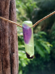 Driftwood with metallic green and purple resin