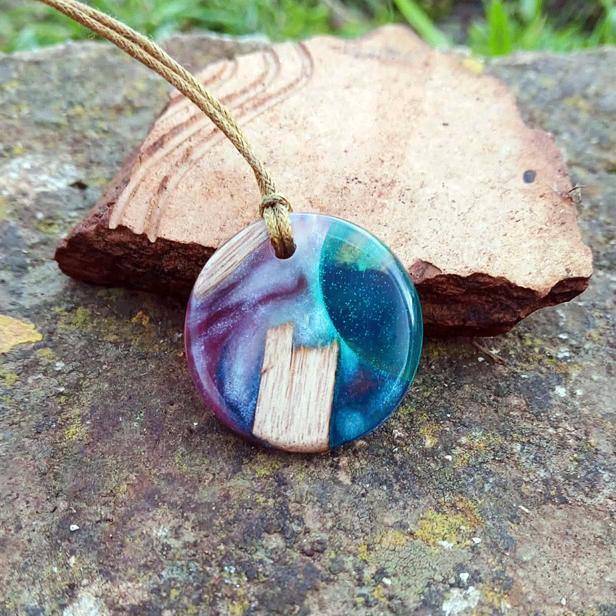 Driftwood with transparent turquoise and pink resin