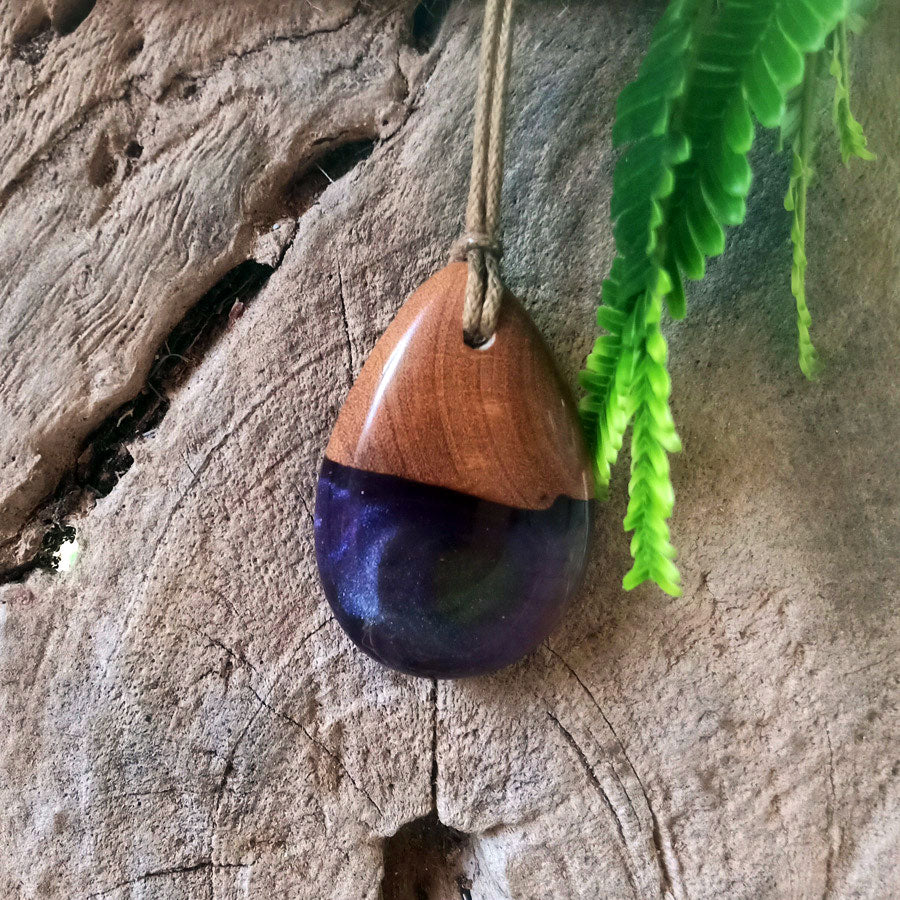 Driftwood with light purple and green resin