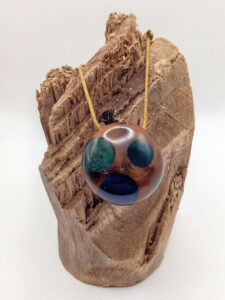 Driftwood with blue and green resin dots