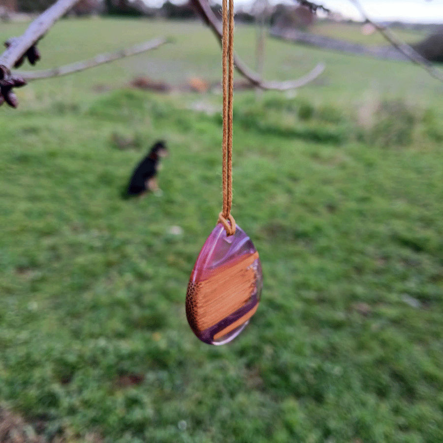 Driftwood with transparent purple and pink resin