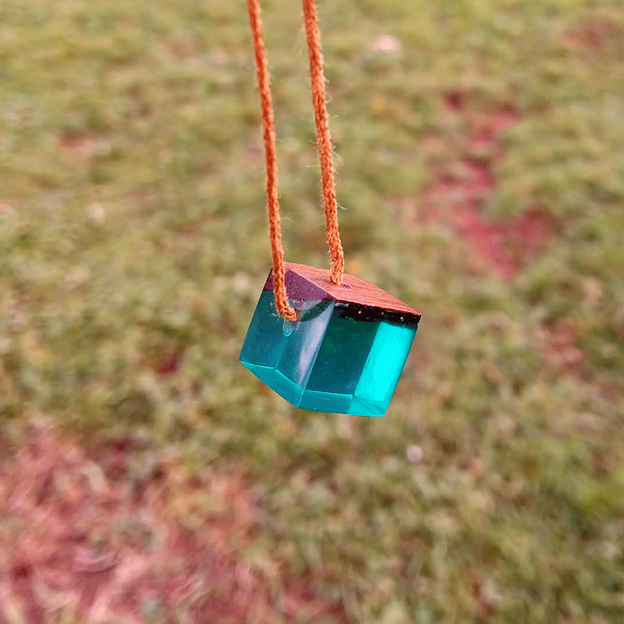 Driftwood with transparent teal resin