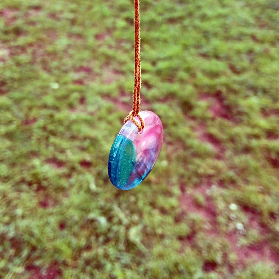 Driftwood with transparent turquoise and pink resin