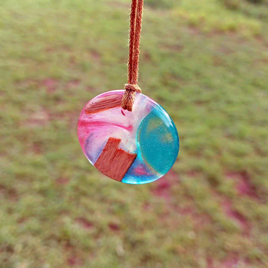 Driftwood with transparent turquoise and pink resin