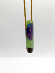 Driftwood with metallic green and purple resin