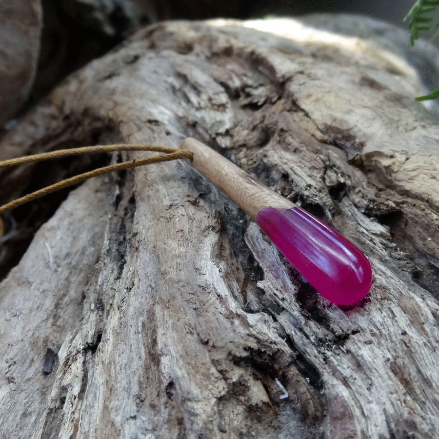 Driftwood with bright pink resin