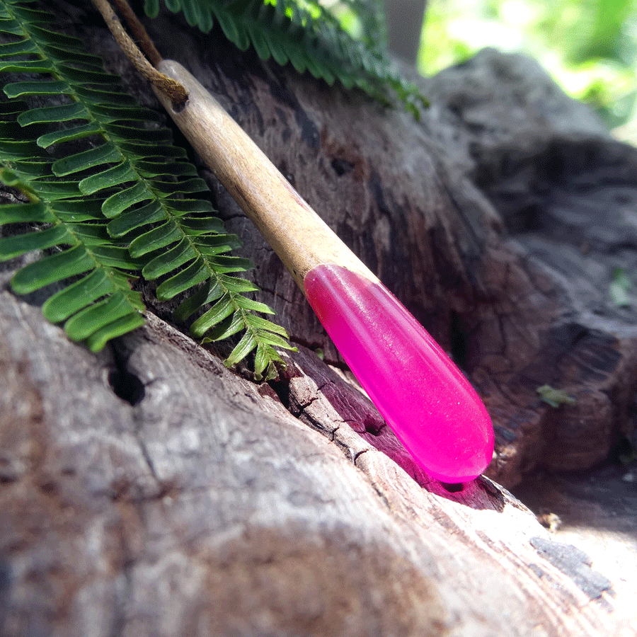 Driftwood with bright pink resin