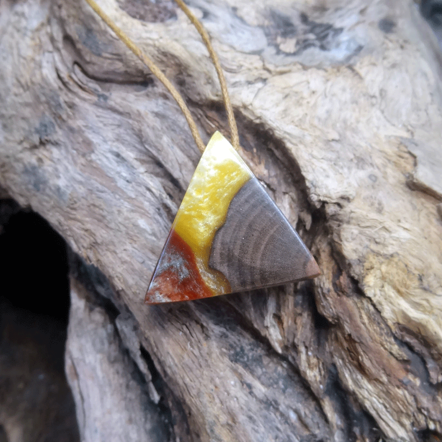 Driftwood with yellow and red resin