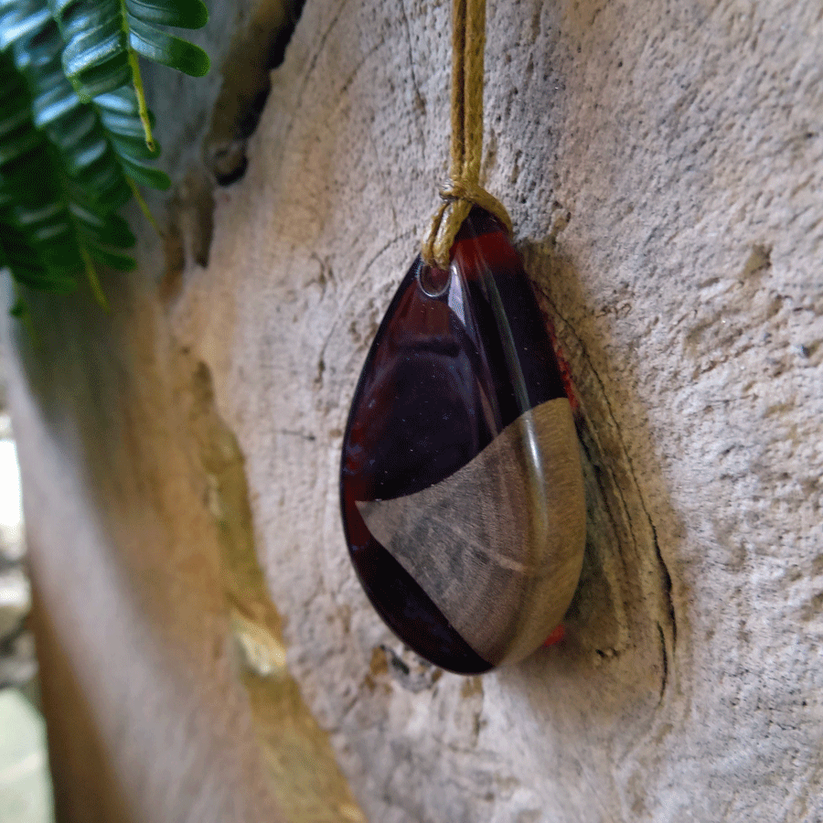 Driftwood with dark red resin