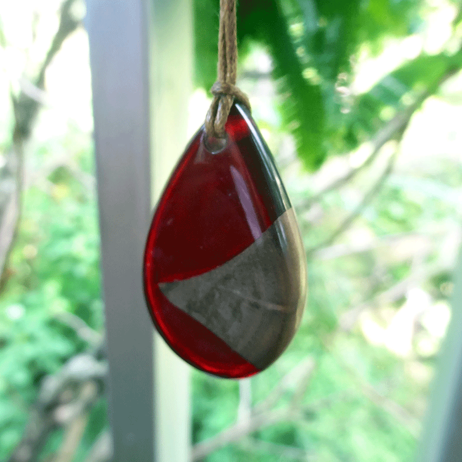 Driftwood with dark red resin