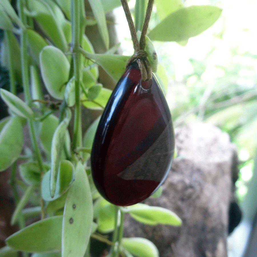 Driftwood with dark red resin