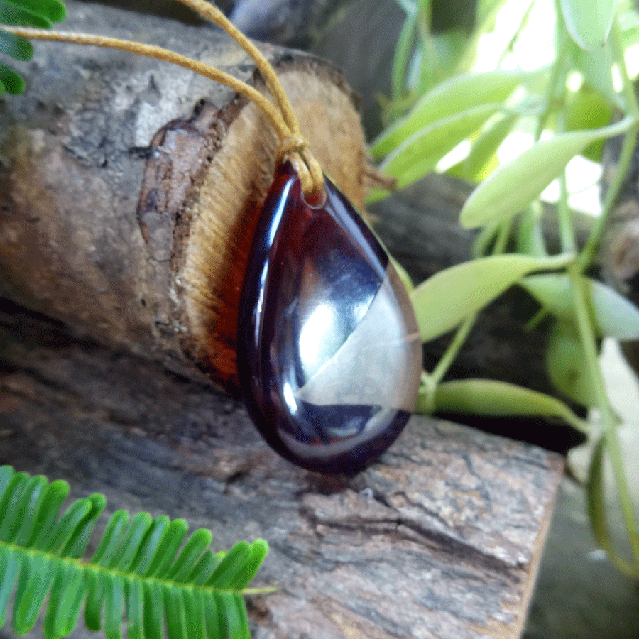 Driftwood with dark red resin