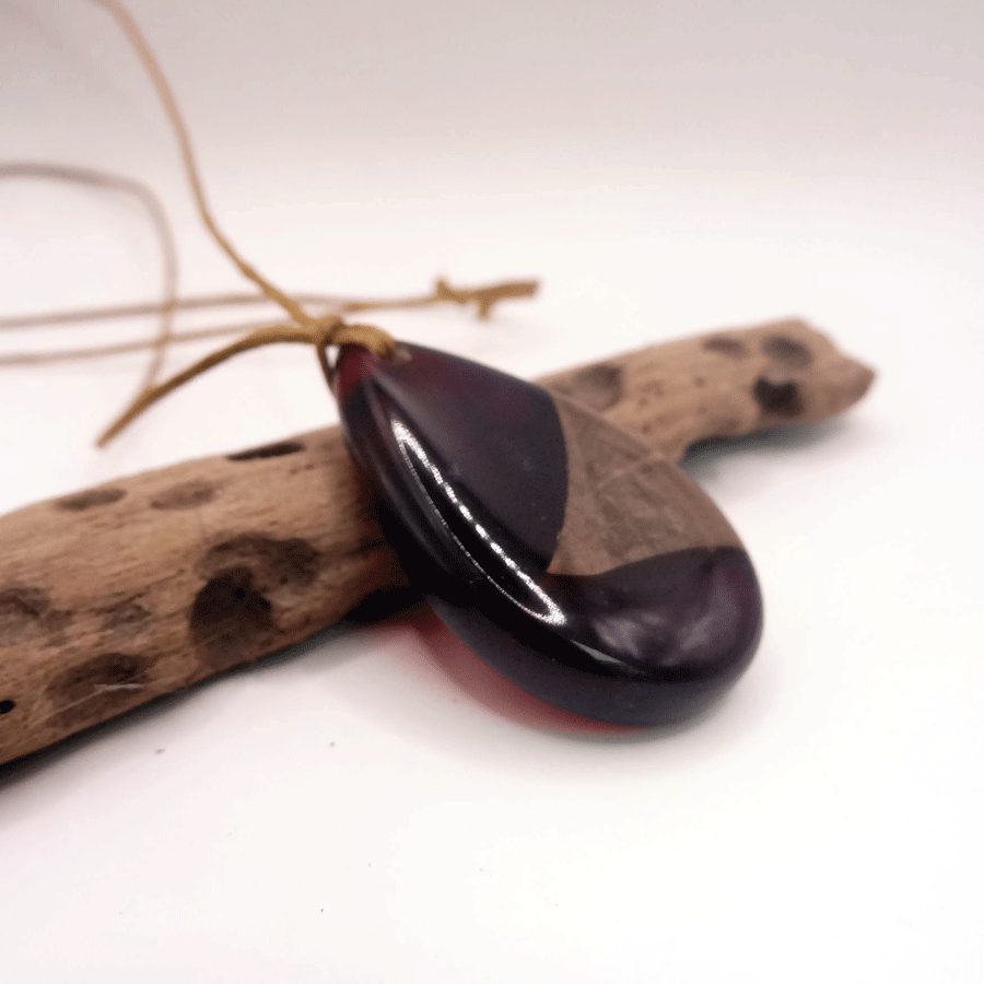 Driftwood with dark red resin