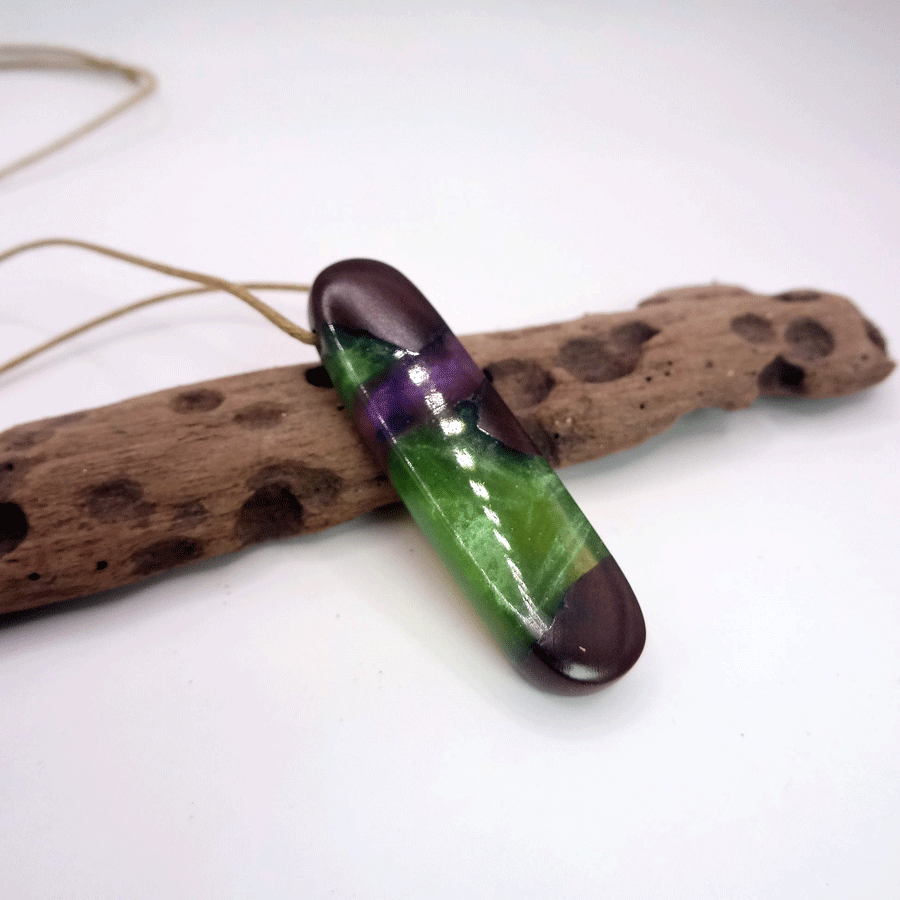 Driftwood with green and purple resin