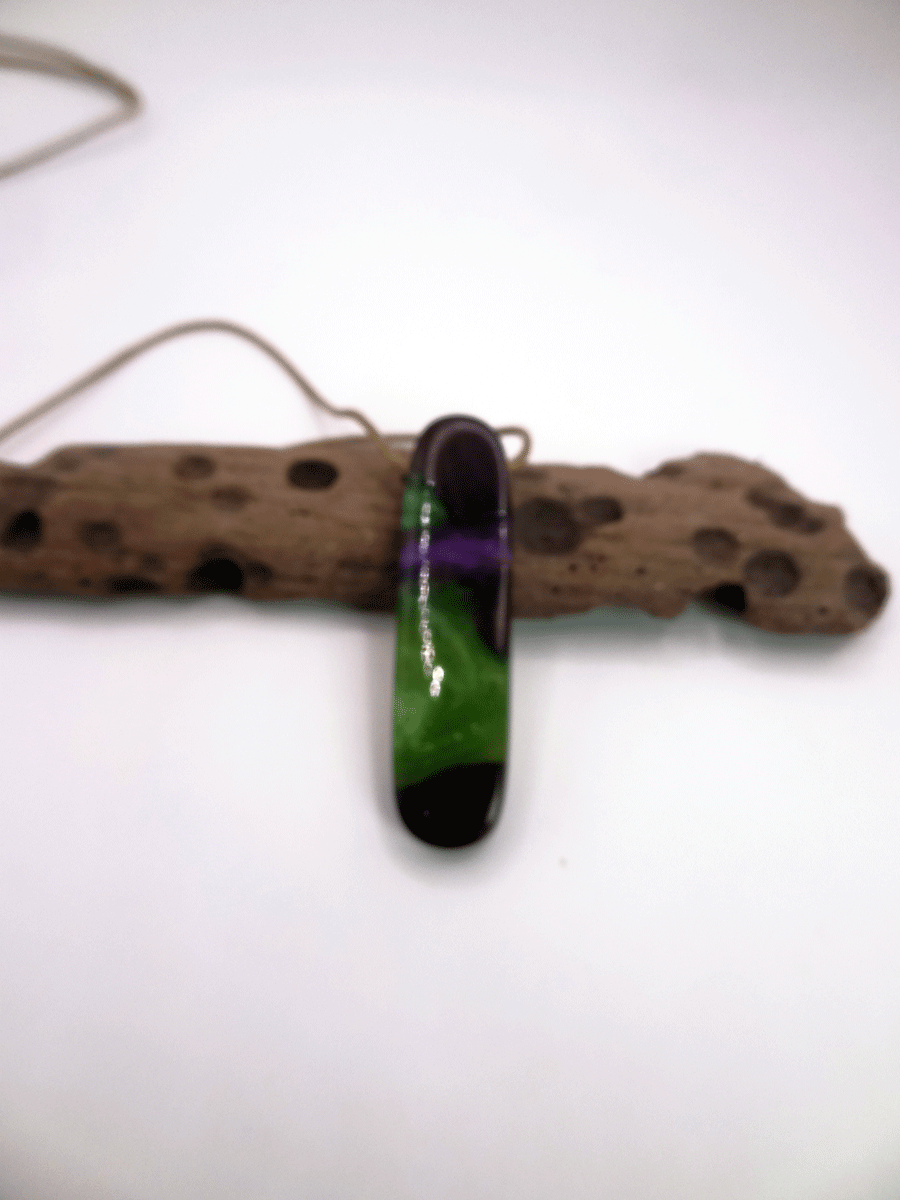 Driftwood with green and purple resin