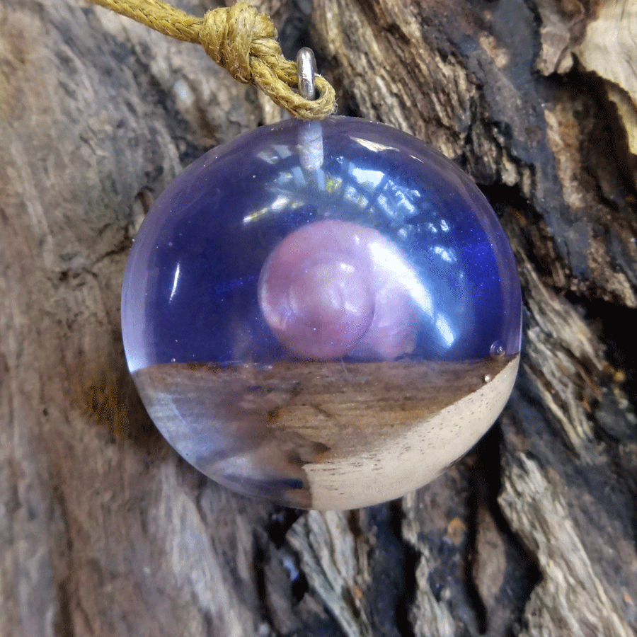 Driftwood with light purple resin and shell