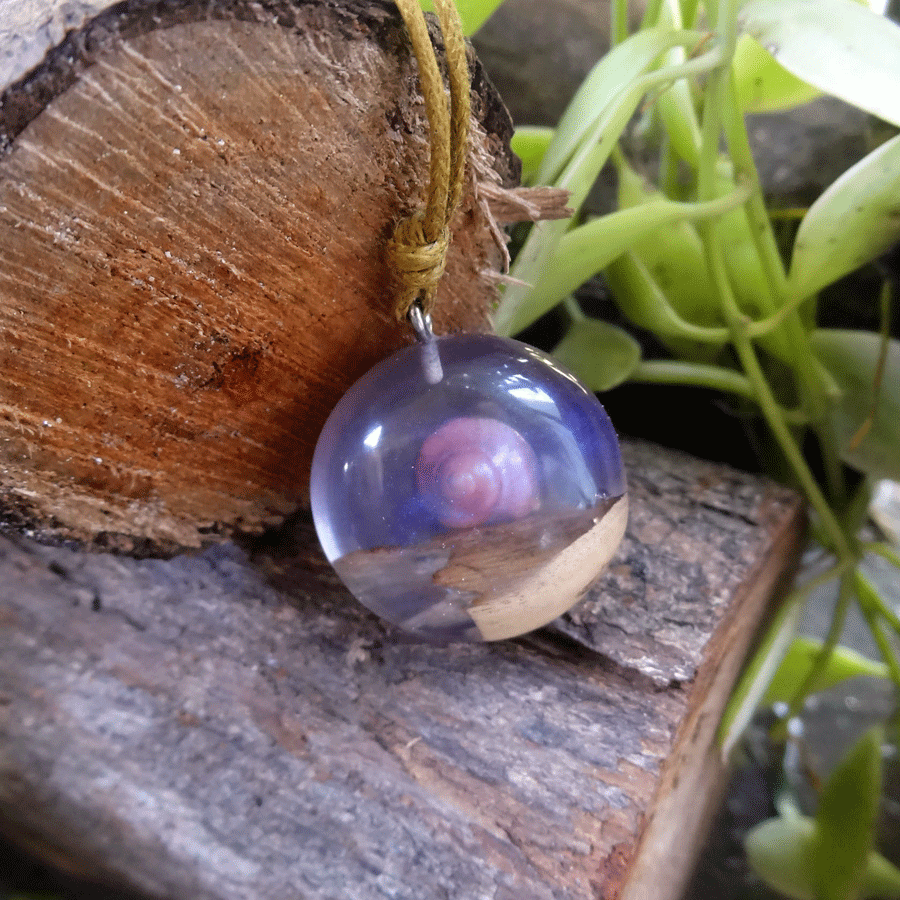 Driftwood with light purple resin and shell