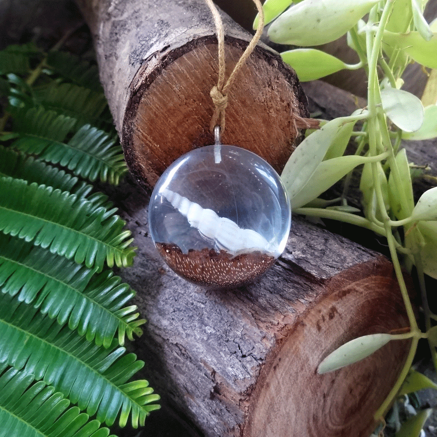 Driftwood with light blue resin and shell