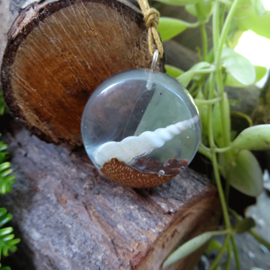 Driftwood with light blue resin and shell