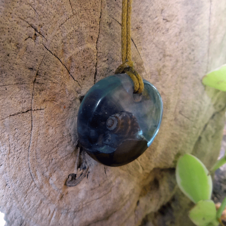 Driftwood with light blue resin and shell