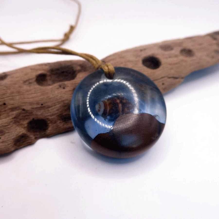 Driftwood with light blue resin and shell