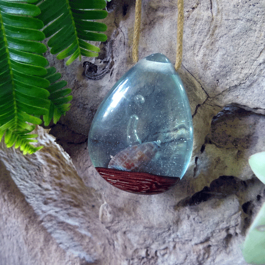 Driftwood with light blue resin and shell