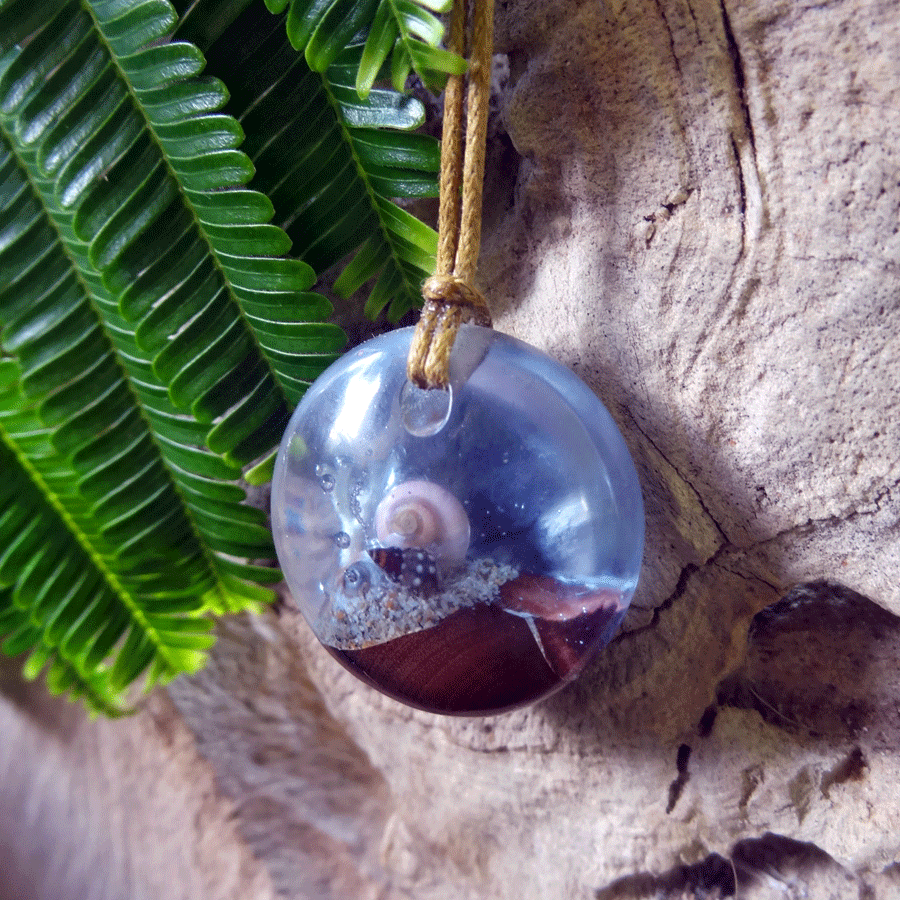 Driftwood with light blue resin and shells